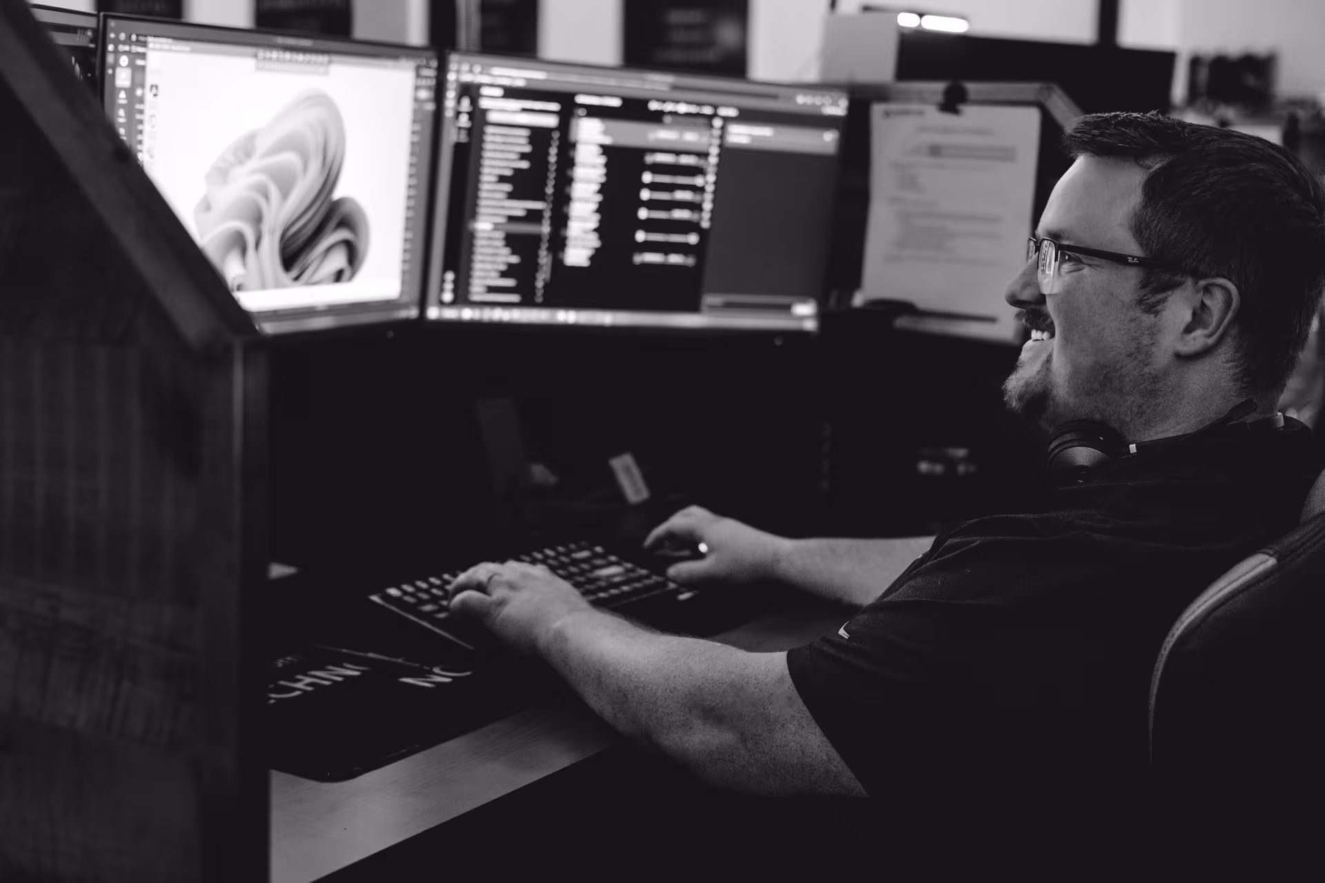 Support specialist wearing a headset at a workstation